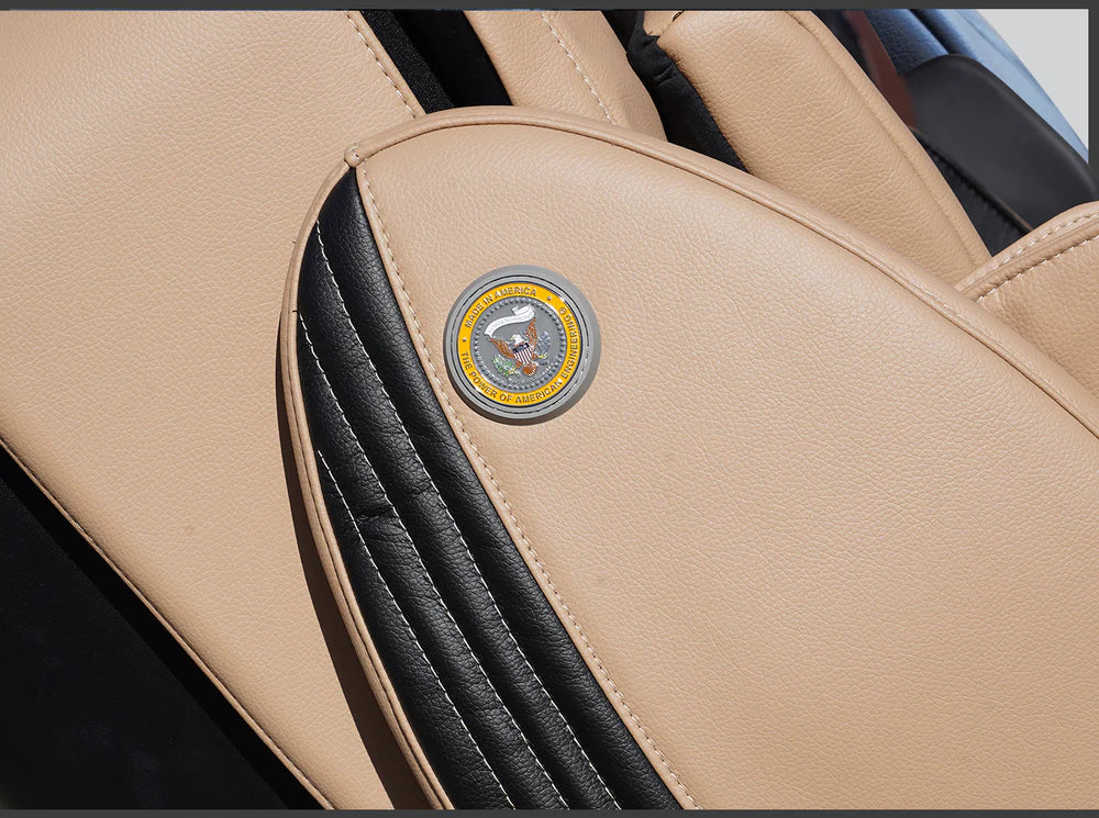 Close-up of a car seat with a logo on a beige and black interior.